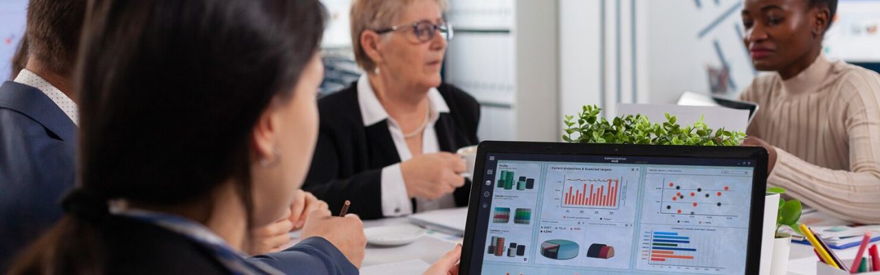 young-woman-analysing-charts-laptop-start-up-business-meeting-room_482257-5026